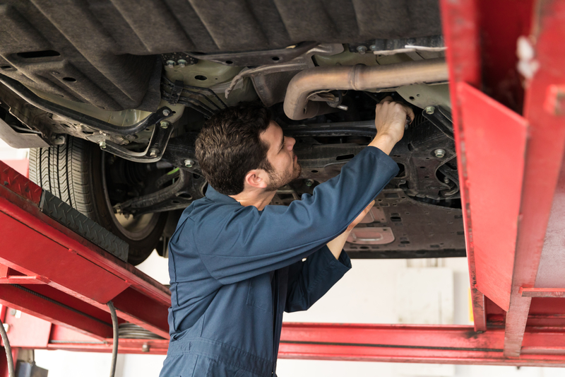 Car Servicing Belfast | Male Technician Servicing Car In Repair Shop | Ards Brake & Clutch Service Centre Newtonards